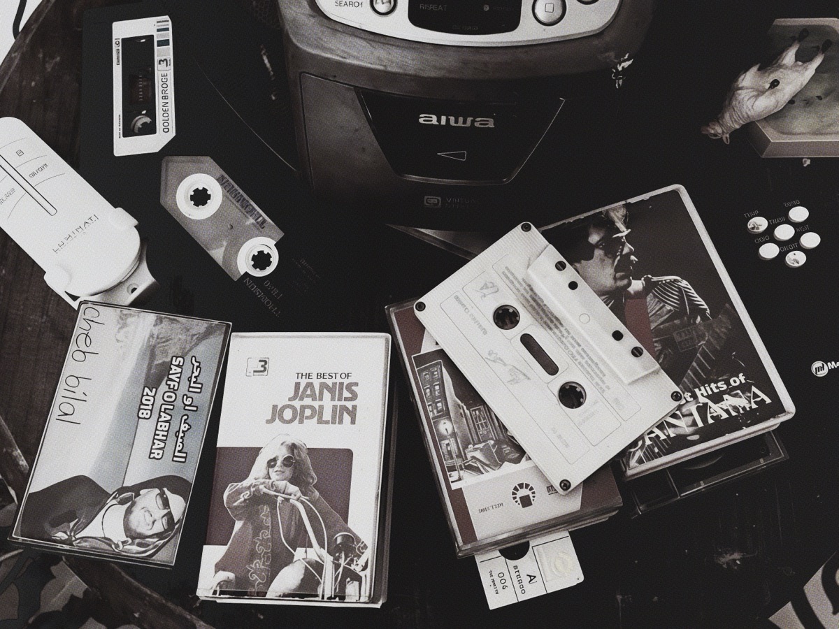 Collection of cassette tapes scattered on a table
